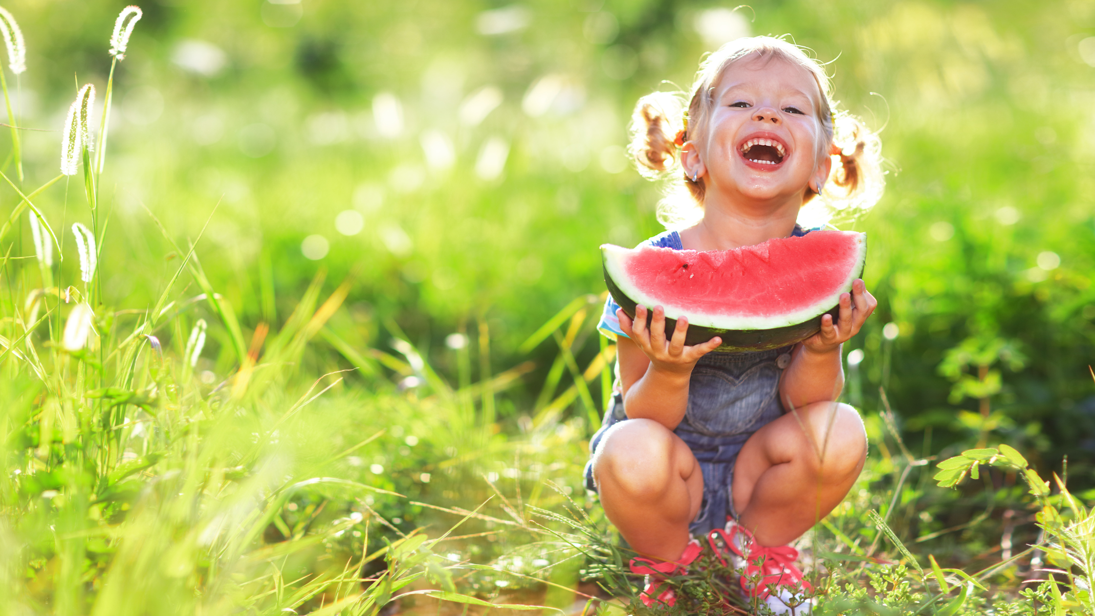 Child smiling with Watermelon