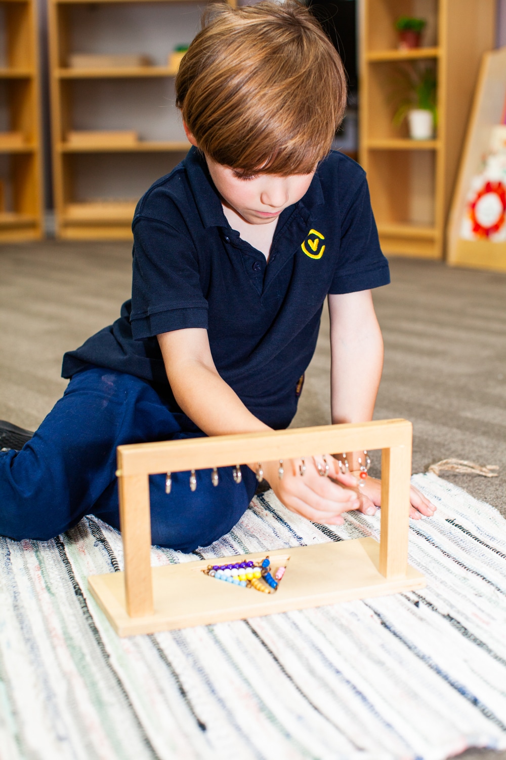 Boy Playing with Montessori toy