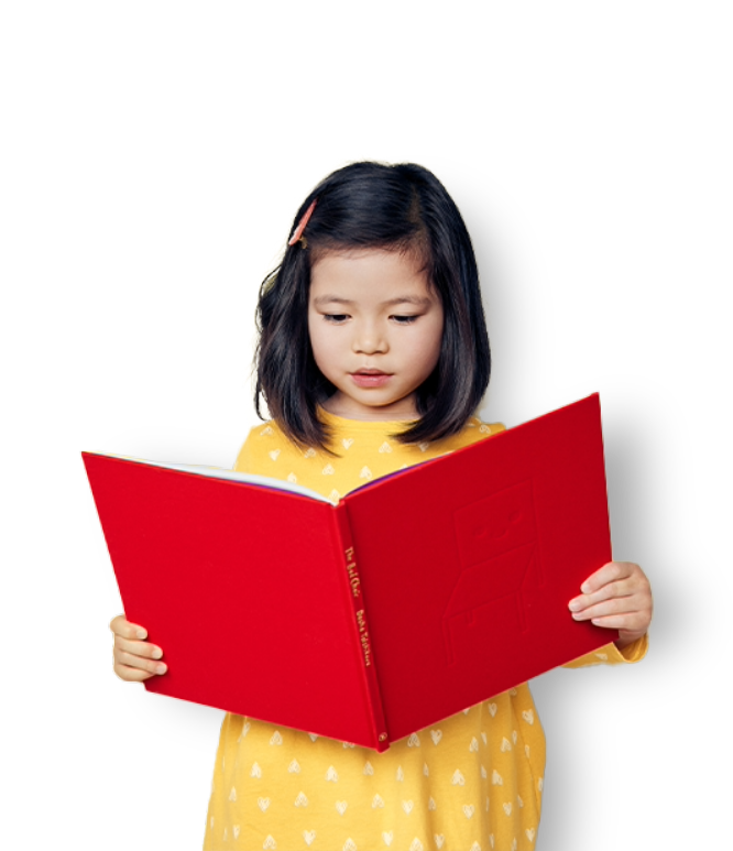 Girl wearing yellow dress holding a big red book
