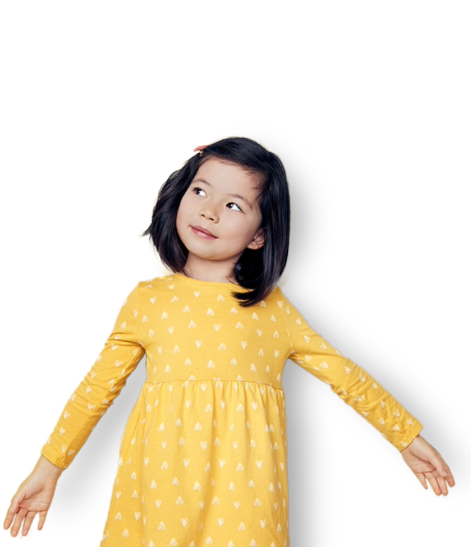 Child dancing in yellow dress