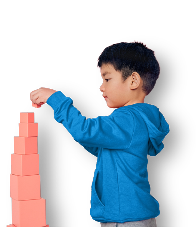 Boy building block tower