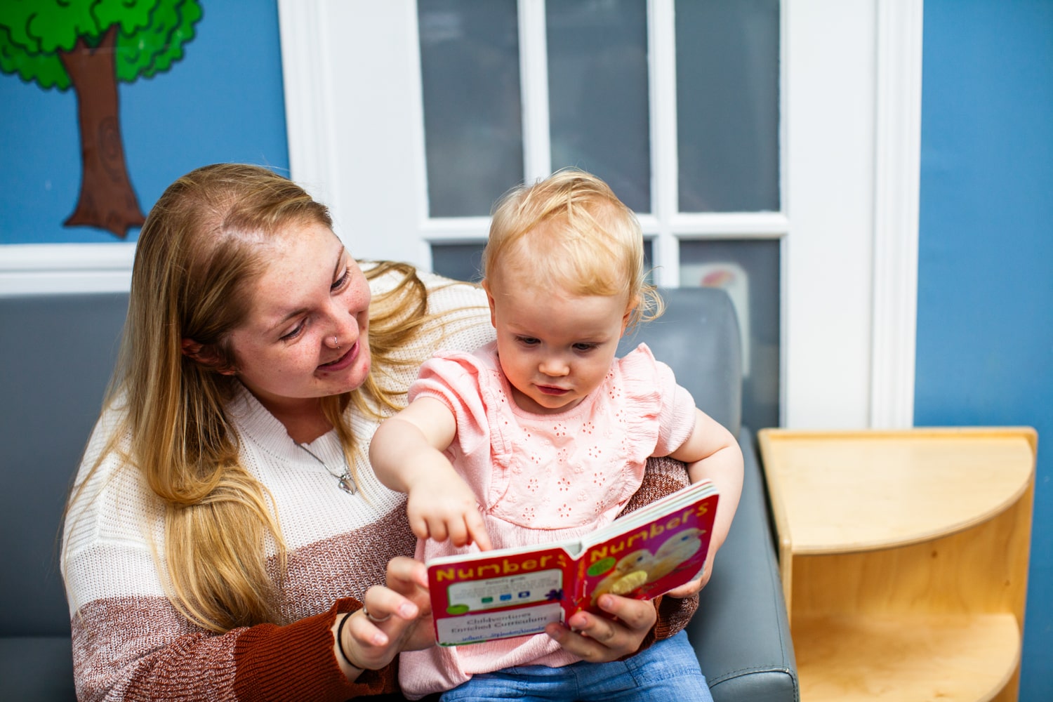 A parent reading to her child